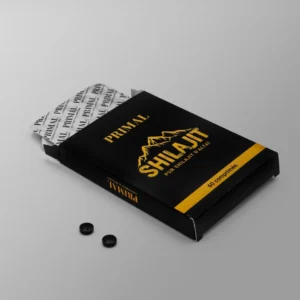 Boîte de comprimés Primal Shilajit ouverte, deux comprimés.